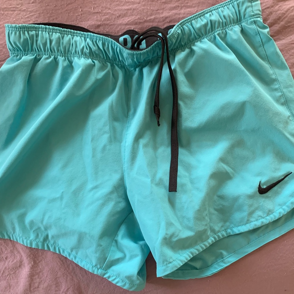 Blue Nike shorts with compression shorts attached